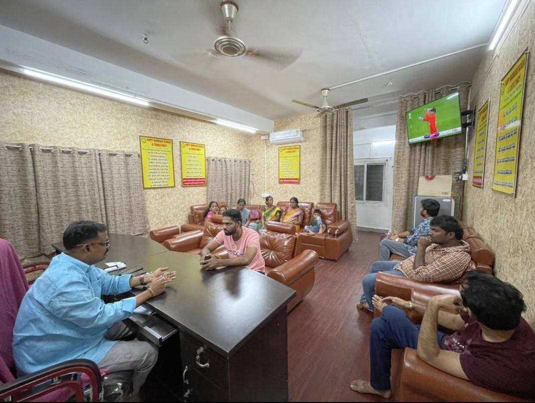 Happy Marriage Bureau office - family consultation in progress